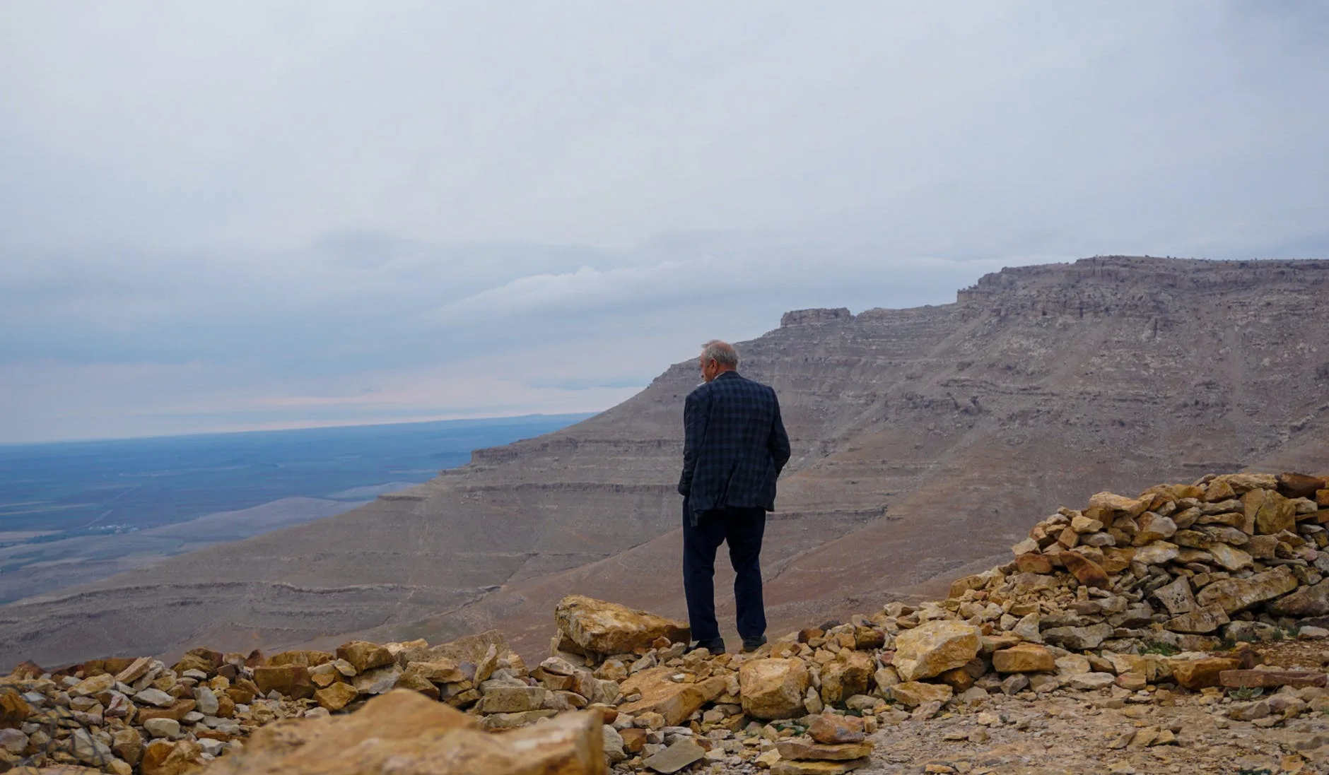 man standing at the edge of a cliff